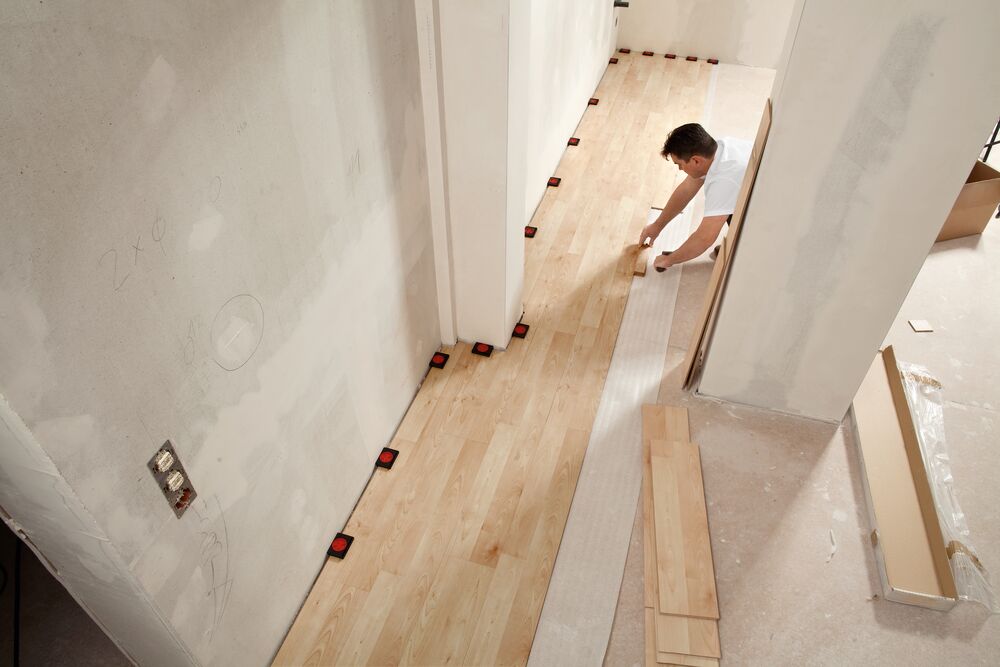 AV2 spacers maintain the distance between a floating laminate floor and the wall